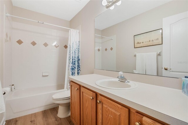 126 Seville Chase Dr, Winter Springs, FL 32708 - full bath with toilet, vanity, shower / tub combo, and wood finished floors