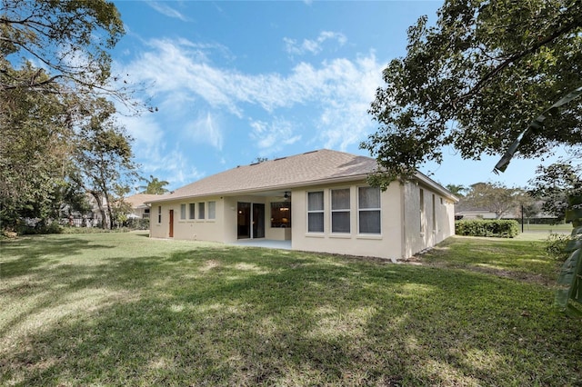 126 Seville Chase Dr, Winter Springs, FL 32708 - back of house featuring stucco siding, a lawn, and a ceiling fan