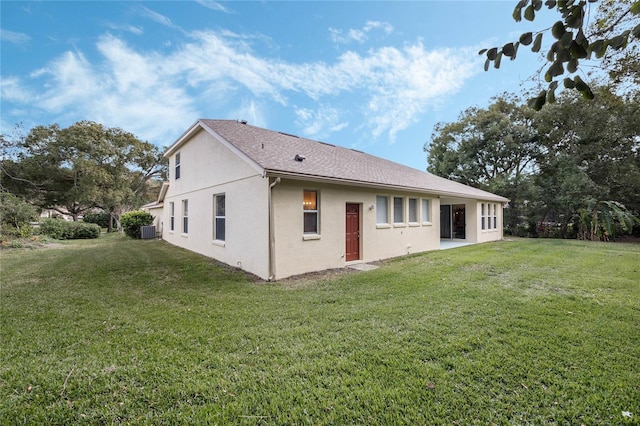 126 Seville Chase Dr, Winter Springs, FL 32708 - back of house featuring a lawn, stucco siding, and central AC unit