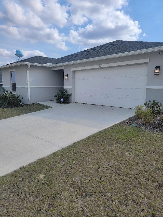 ranch-style house featuring a garage