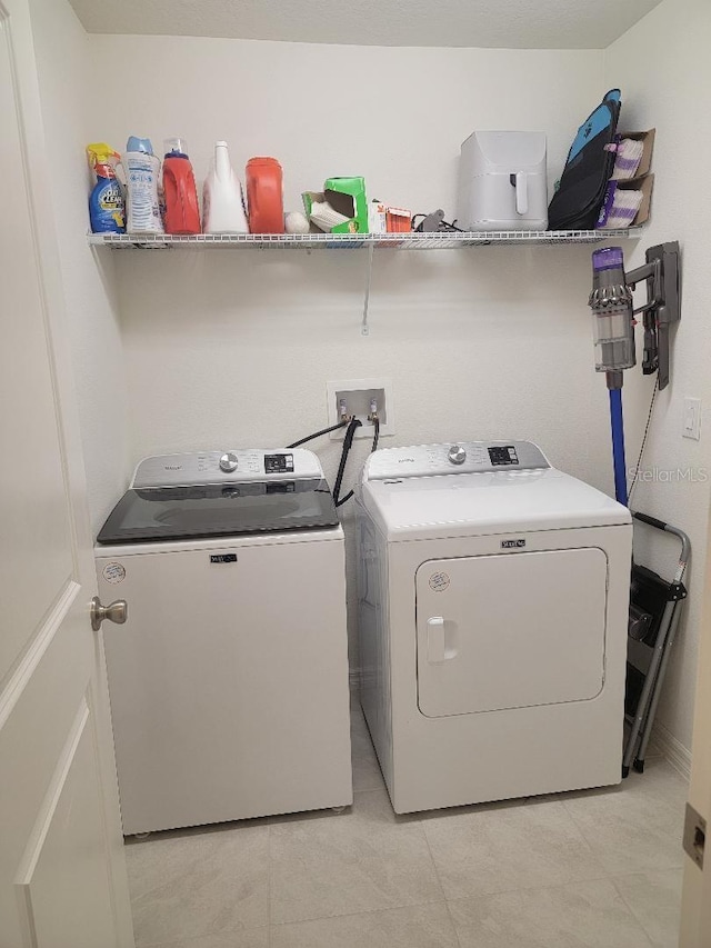 laundry area with washer and clothes dryer