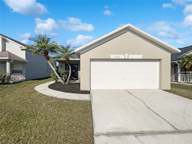 ranch-style home with a garage and a front lawn