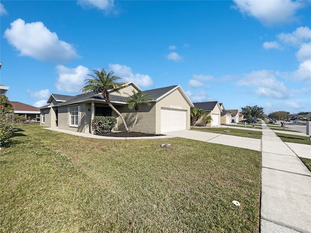 view of front facade featuring a garage and a front lawn