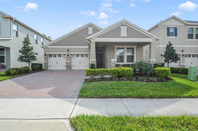 view of front of home with a garage, a front yard, and central air condition unit