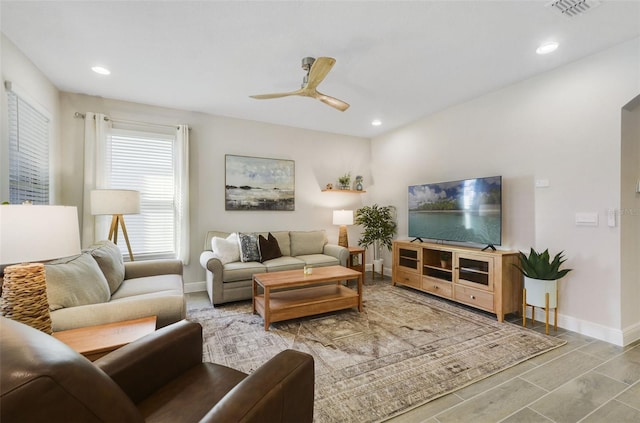 living room featuring ceiling fan