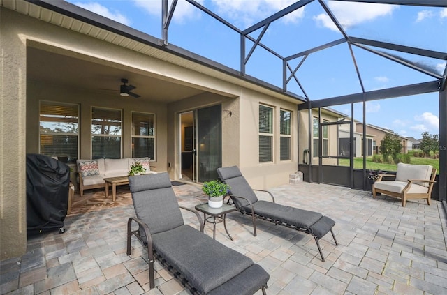 view of patio with an outdoor living space, a lanai, a grill, and ceiling fan