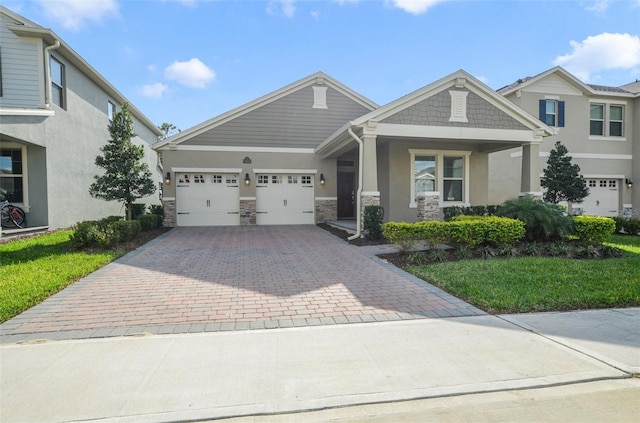 view of front of property featuring a garage and a front yard