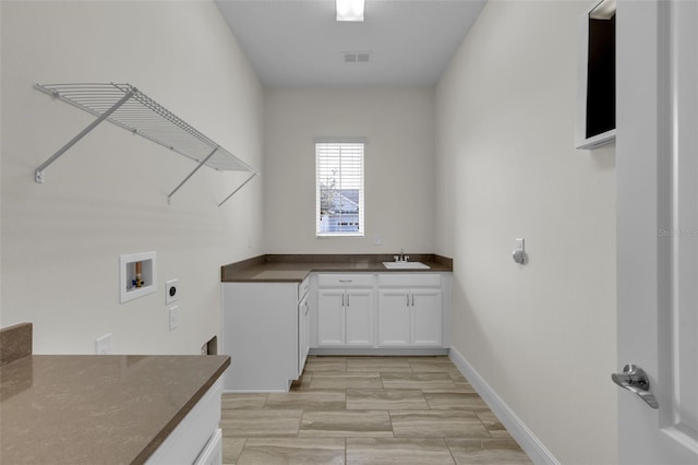 washroom featuring washer hookup, sink, and hookup for an electric dryer