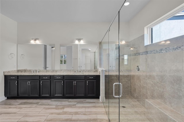 bathroom featuring vanity and walk in shower