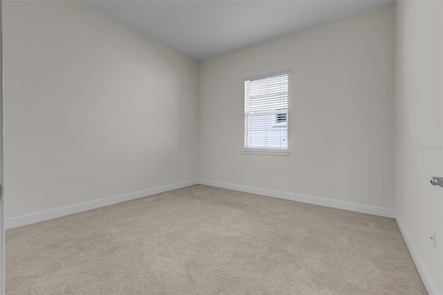 spare room with light carpet