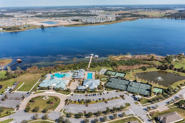 birds eye view of property with a water view