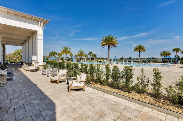 view of patio / terrace featuring a community pool