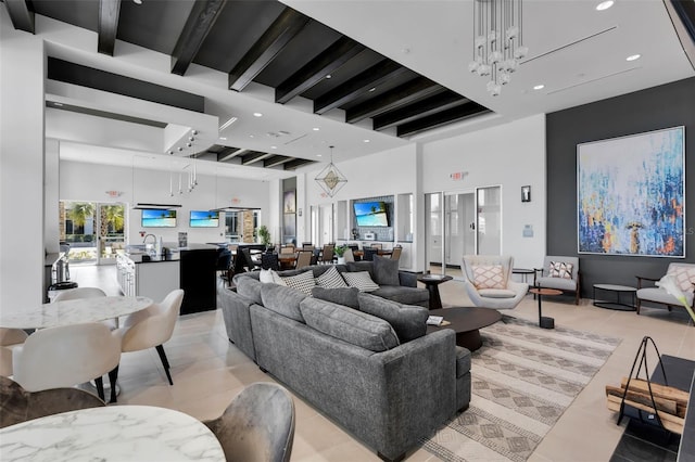 living room with light tile patterned floors, a towering ceiling, a chandelier, and beamed ceiling