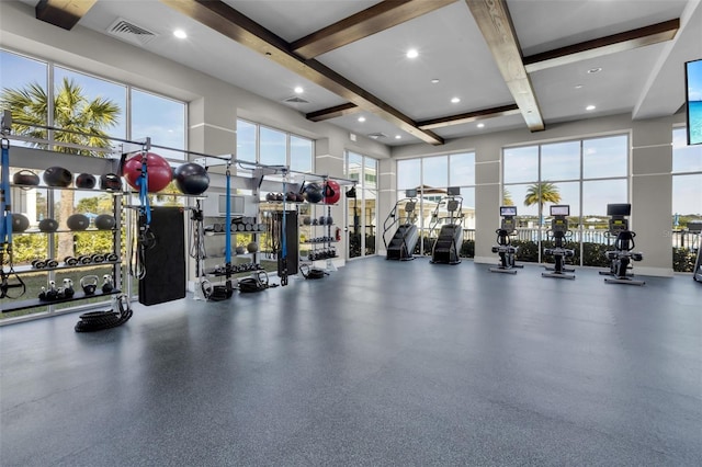 workout area with a high ceiling