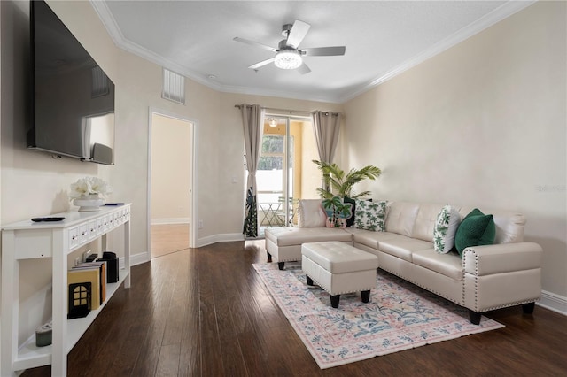 living room featuring crown molding, dark hardwood / wood-style floors, and ceiling fan