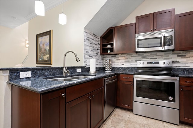 kitchen with pendant lighting, sink, appliances with stainless steel finishes, decorative backsplash, and kitchen peninsula