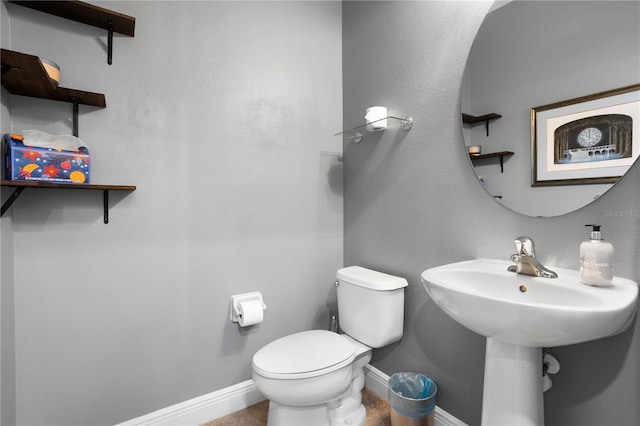 bathroom with toilet and sink