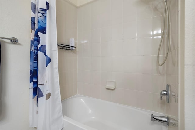 bathroom featuring shower / tub combo with curtain