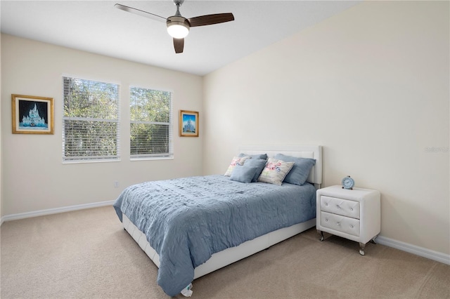 bedroom featuring light carpet and ceiling fan