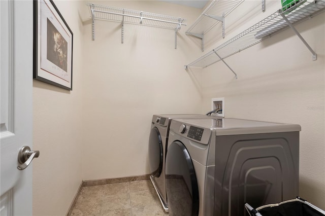 washroom with separate washer and dryer