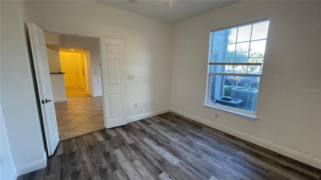 spare room featuring dark hardwood / wood-style floors