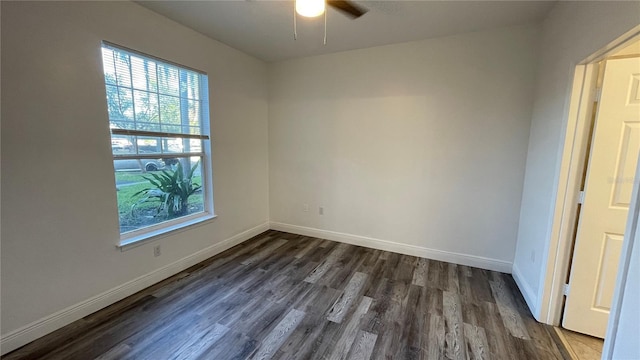 unfurnished room with dark wood-type flooring and ceiling fan