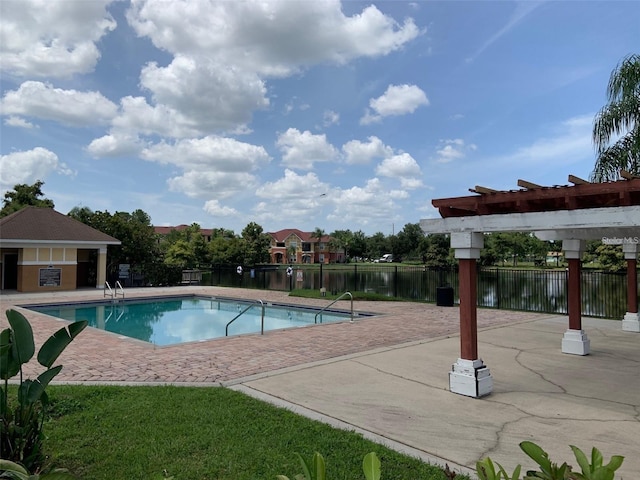 view of swimming pool featuring a water view, a pergola, and a patio area