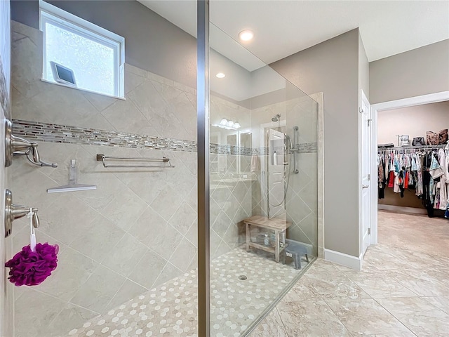 bathroom featuring tiled shower