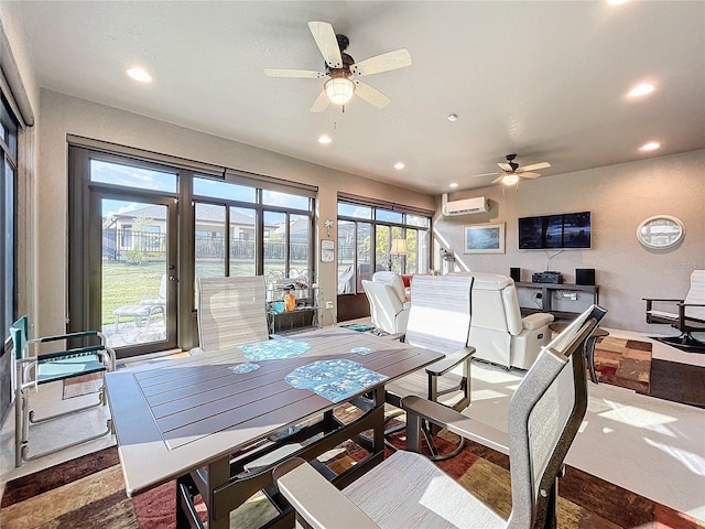 dining space with ceiling fan and a wall mounted AC