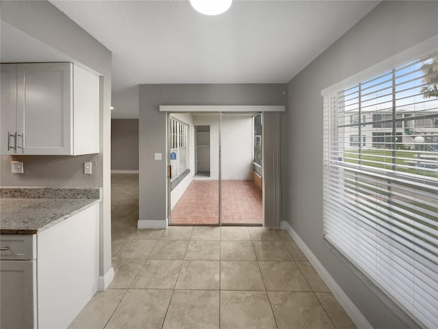 interior space featuring light tile patterned floors