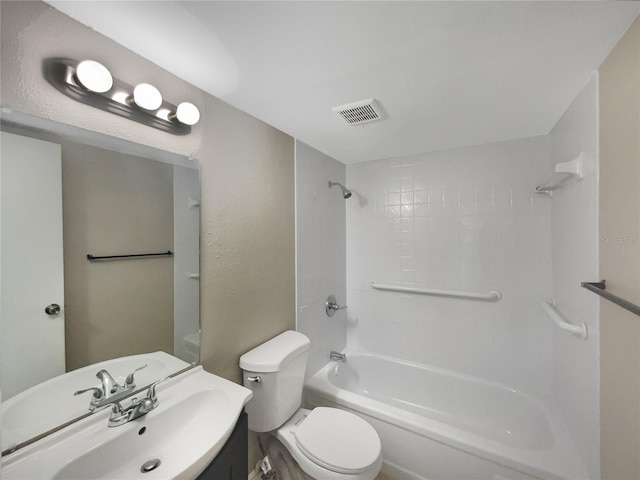 full bathroom featuring shower / bath combination, vanity, and toilet