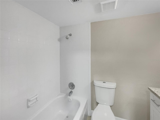 full bathroom featuring vanity, toilet, and tiled shower / bath combo