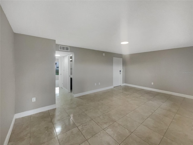 unfurnished room with light tile patterned floors