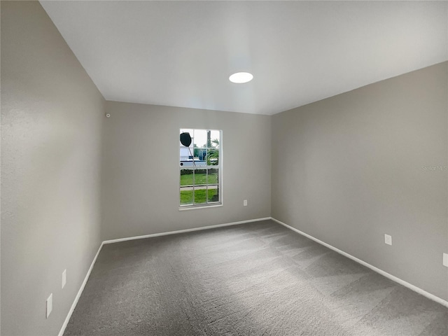 unfurnished room featuring carpet flooring