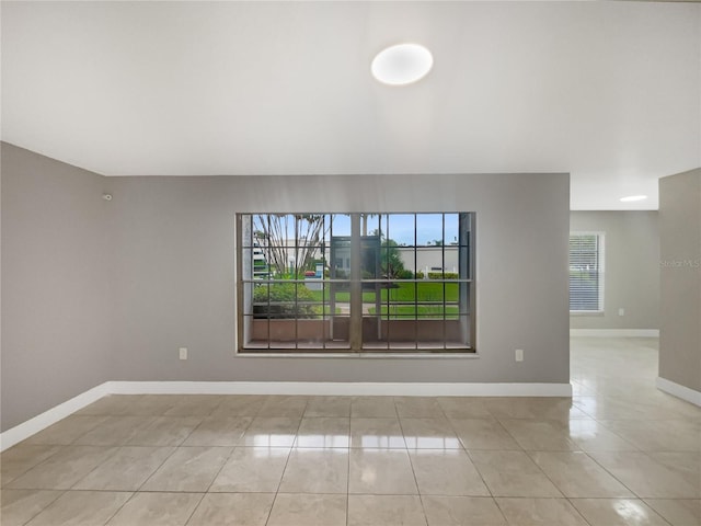 empty room featuring light tile patterned floors