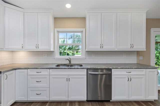 kitchen featuring white cabinetry, dishwasher, sink, backsplash, and dark wood-type flooring