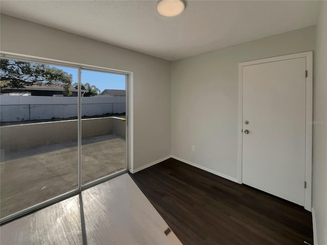 empty room featuring dark hardwood / wood-style floors