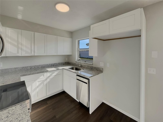 kitchen featuring dark hardwood / wood-style floors, sink, white cabinets, light stone counters, and stainless steel appliances