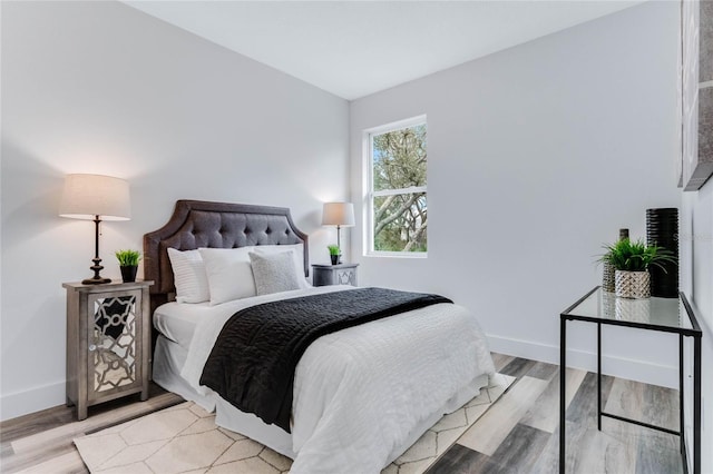 bedroom with light hardwood / wood-style flooring