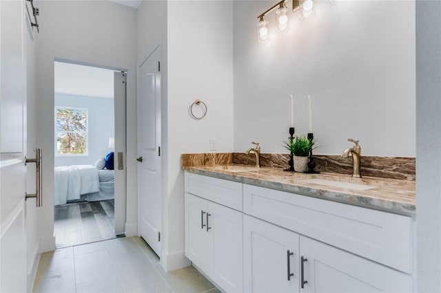 bathroom featuring tile patterned floors and vanity