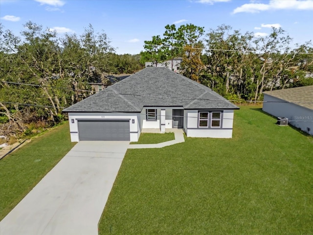 view of front of property featuring a garage and a front yard