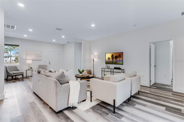 living room with light hardwood / wood-style floors