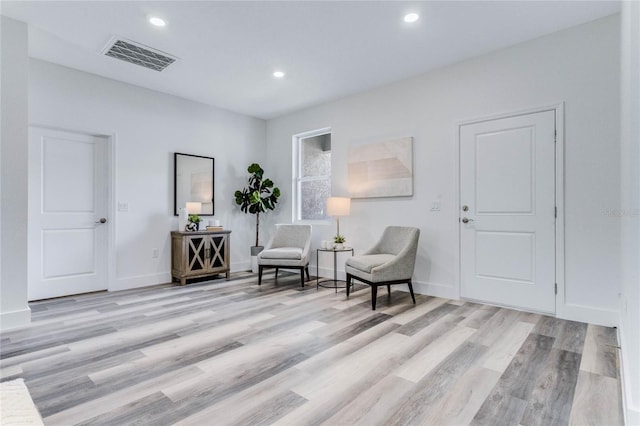 sitting room featuring light hardwood / wood-style floors