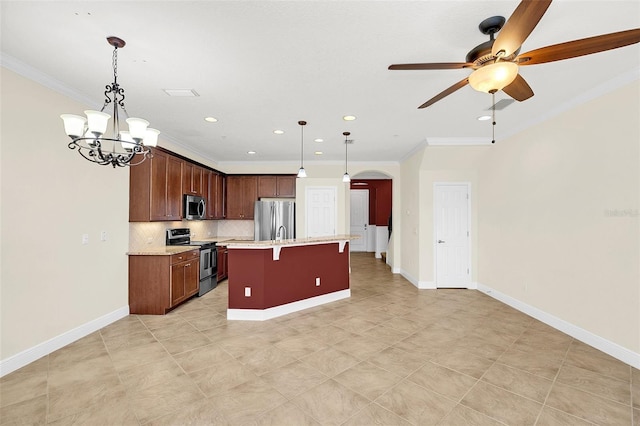 kitchen with pendant lighting, stainless steel appliances, ornamental molding, an island with sink, and decorative backsplash