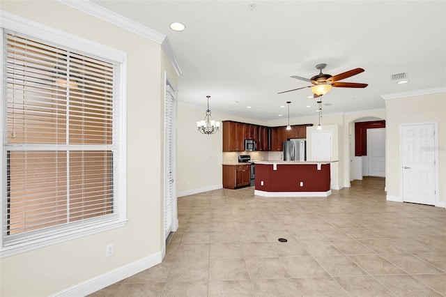 kitchen featuring ceiling fan with notable chandelier, pendant lighting, a center island, stainless steel appliances, and crown molding