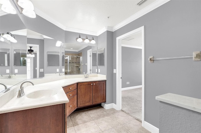 bathroom featuring ornamental molding, vanity, ceiling fan, a shower with door, and tile patterned floors