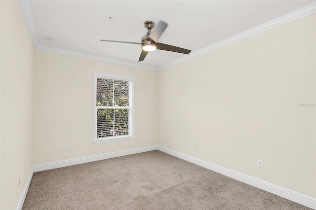 unfurnished room with ornamental molding, light colored carpet, and ceiling fan