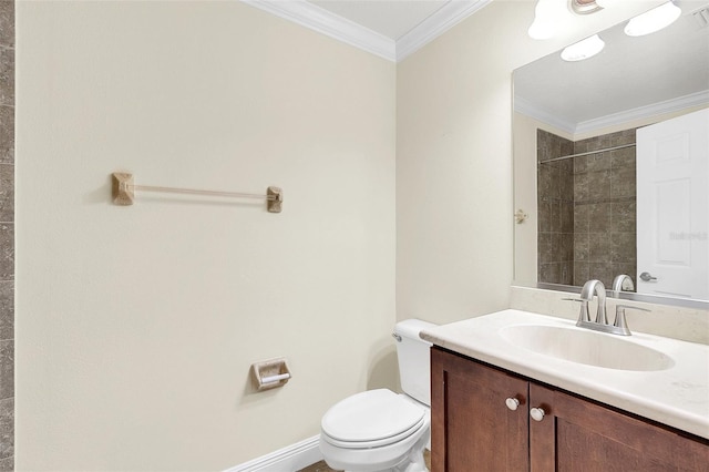 bathroom featuring vanity, ornamental molding, toilet, and tiled shower