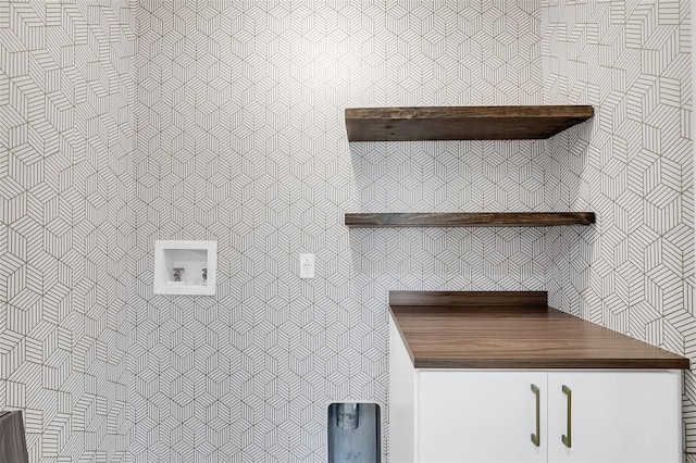 interior space featuring cabinets and washer hookup