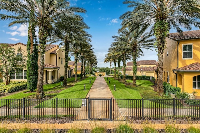 view of home's community with a yard